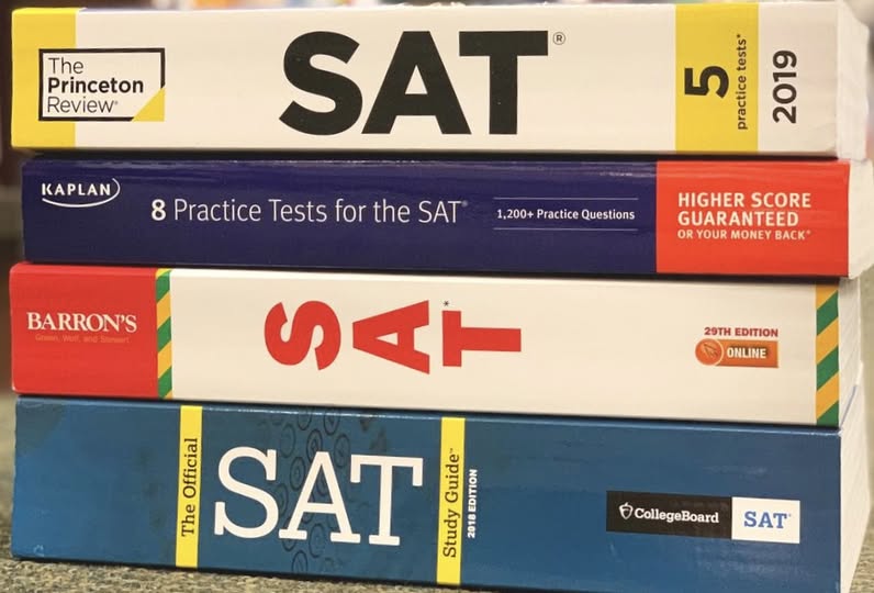 Stack of SAT prep books — Princeton Review, Kaplan, Barron's, The Official SAT Study Guide